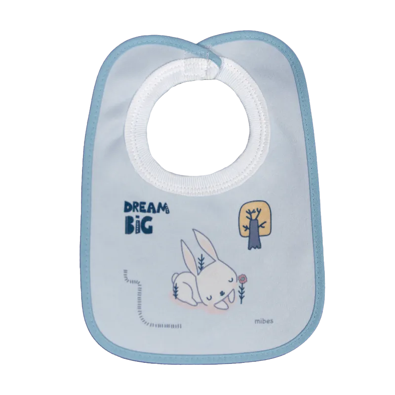 1002663 - Babero chico con cuello ribb y abrojo "Dream Big".
